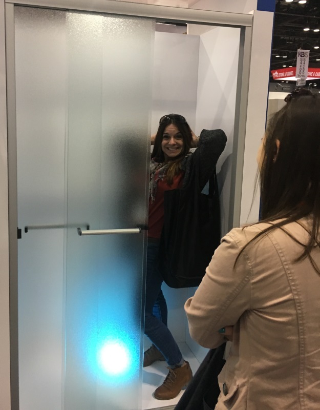 Cheryl testing the shower display at the 2017 Kitchen and Bath Industry Show